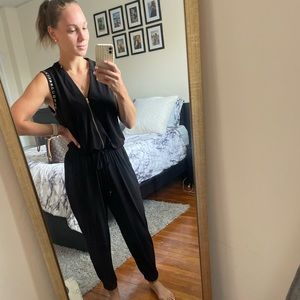 Loose fitting jumpsuit black with gold accent details pockets Womens size medium